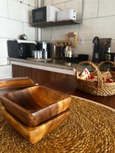 a wooden bowl on a counter in a kitchen at Hospedaje Rivera Chico in Rivera