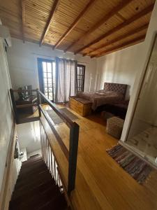 a living room with a couch and a bed in it at Hospedaje Rivera Chico in Rivera