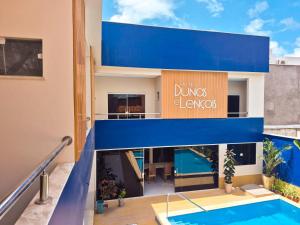 a view of a building with a swimming pool at Hotel Dunas e Lençóis in Barreirinhas