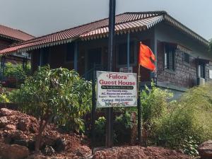 a sign in front of a guest house at Fulora Guesthouse in Dapoli +7 photos