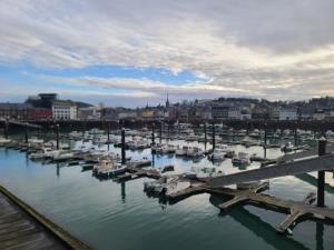 a group of boats docked in a harbor at studio Anémos in Fécamp +3 photos