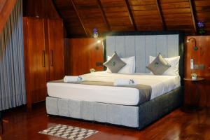 a bedroom with a large bed in a room at 8 Acres Tea Escape in Deniyaya +38 photos