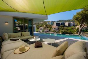 a living room with a couch and a pool at Luxury Seafront Villa Aman Korcula with Pool in Korčula