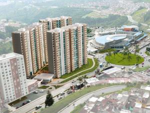 an aerial view of a city with tall buildings at Descansa, comodidad y confort in Manizales
