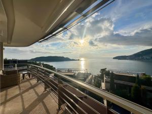 a view of the water from a balcony at Casa La Perla in Budva