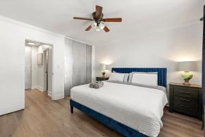 a bedroom with a bed and a ceiling fan at Atlanta North Urban Chic 2BR- 7th Floor in Atlanta