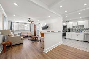 a kitchen and living room with a couch and a table at Atlanta North Urban Chic 2BR- 7th Floor in Atlanta