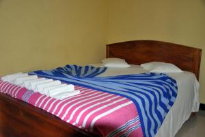 Voodi või voodid majutusasutuse Hotel Pearl Gate toas