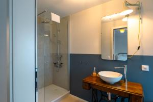 a bathroom with a sink and a shower at Il Platano Guest House in Quartino +24 photos