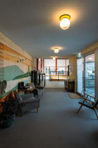 a living room with a couch and a table and chairs at Il Platano Guest House in Quartino