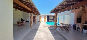 a patio of a house with a swimming pool at Casa Parnaíba in Parnaíba
