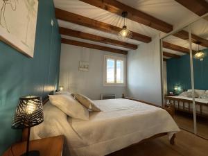 a bedroom with a large bed with a mirror at Aguerrea in Macaye