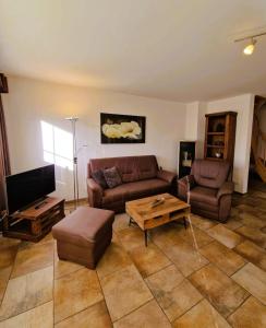 a living room with a couch and a coffee table at Strandstr_ in Zingst
