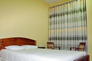 Voodi või voodid majutusasutuse Hotel Pearl Gate toas