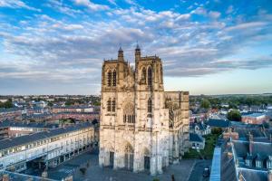 an old cathedral in a city with buildings at la penombre spa in Abbeville