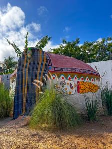 a painting of an elephant on the side of a building at Las siete lunas in Ucú