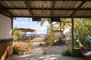 a view of the beach from a building at Viento Este Guest House in Popoyo