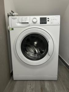 a white washer and dryer in a room at La casetta triangolare in Bernalda