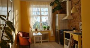 a small kitchen with a window and a stove at Private floor in Molkom +18 photos