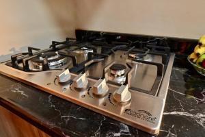 a stove top oven sitting on top of a counter at Loft centrico en Morelia in Morelia +31 photos