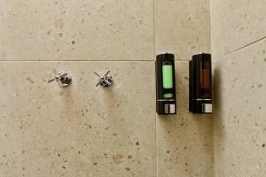 three metal objects on the floor of a bathroom at Loft centrico en Morelia in Morelia