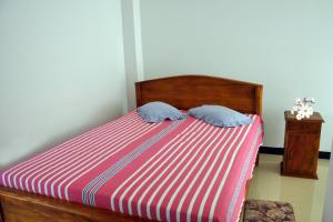 Voodi või voodid majutusasutuse Hotel Pearl Gate toas