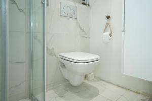 a bathroom with a toilet and a glass shower at Nissa la bella in Nice +30 photos