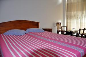 Voodi või voodid majutusasutuse Hotel Pearl Gate toas
