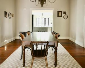 a dining room with a wooden table and chairs at Macons Historic Tatnall Home in Macon +18 photos