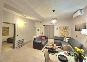 a living room with a couch and a table at Sogno 2 in Parga