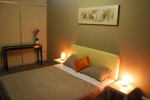 Ein Bett oder Betten in einem Zimmer der Unterkunft Borneo Sweet Guesthouse