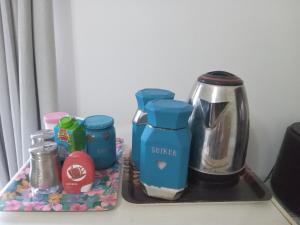 a tray with a coffee maker and a coffee pot at Ebenezer Verblyf in Fraserburg +23 photos