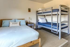 a bedroom with two bunk beds and a bed at Infinity Edge Pool & Fire Pit: Spicewood Getaway! in Spicewood