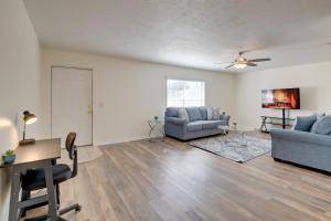 a living room with two couches and a table at Steps from Crystal River: Crystal River Getaway! in Crystal River