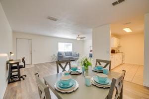 a dining room and living room with a table and chairs at Steps from Crystal River: Crystal River Getaway! in Crystal River