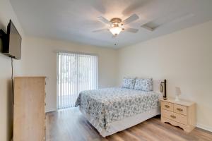 a bedroom with a bed and a ceiling fan at Steps from Crystal River: Crystal River Getaway! in Crystal River