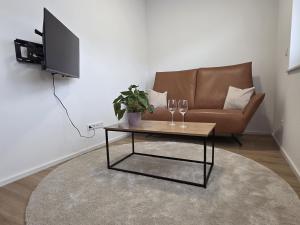 a living room with a couch and a coffee table at Zippel`s Fewo M14 in Bad Buchau