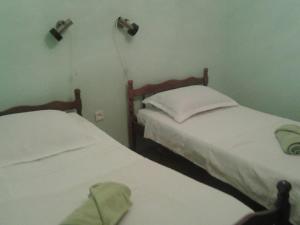 two beds in a small room with at Apartment Dora in Splitska