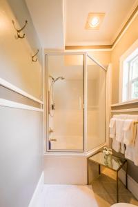 a bathroom with a shower and a glass shower stall at Inn St Helena in St. Helena +71 photos