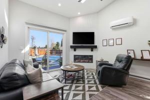 a living room with a couch and a fireplace at Angie Oasis Yard, Loft & Stocked Kitchen in San Ramon