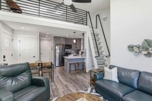 a living room with a couch and a kitchen at Angie Oasis Yard, Loft & Stocked Kitchen in San Ramon