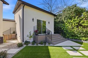 a small white house with a grass yard at Angie Oasis Yard, Loft & Stocked Kitchen in San Ramon