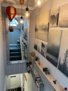 a bathroom with a mirror and a sink at Meadow Cottage in Crieff +6 photos