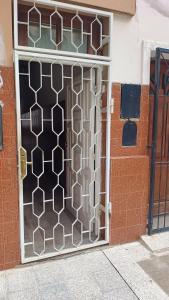 a glass door with a lattice pattern on it at La casa de Samuel in San Ramón de la Nueva Orán
