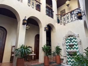 a building with a courtyard with plants in it at Riad Xula Boutique Hotel in Puerto Peñasco