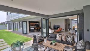 a living room with a couch and a table at Pops lifestyle in Sandton