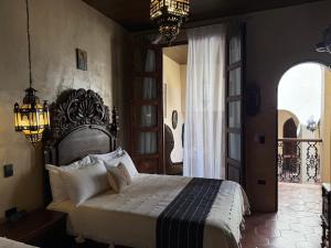 a bedroom with a large bed in a room at Riad Xula Boutique Hotel in Puerto Peñasco