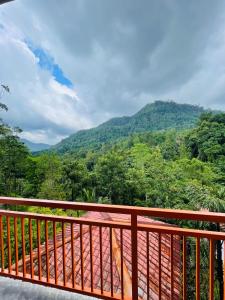 a balcony with a view of a mountain at White Villa Kitulgala in Kitulgala
