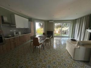 a living room with a table and a couch at Thalore room e apartments in Amantea +17 photos
