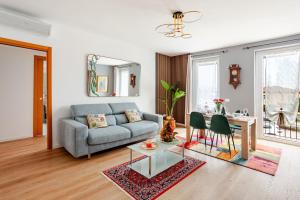 a living room with a couch and a table at SYC I Mulini, Leonardo Academy & MXP & JRC Ispra in Sesto Calende
